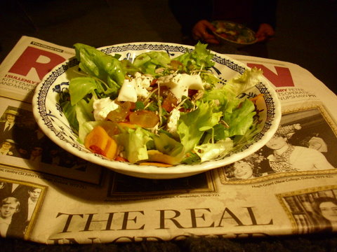Bowl with salad and goat’s cheese and grapes
