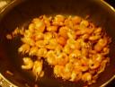 Shrimps frying in pan