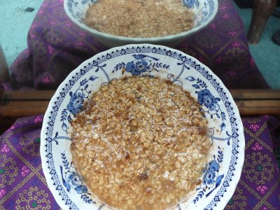 Oats with sultanas soaking in a cereal bowl in fron of a mirror