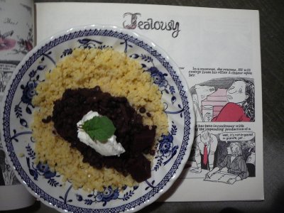 dark beetroot and lentils topped with yogurt on a bed of cooked millet