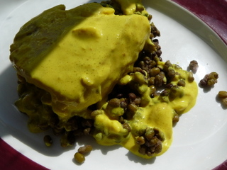 Salmon on a bed of lentils with coconut and turmeric