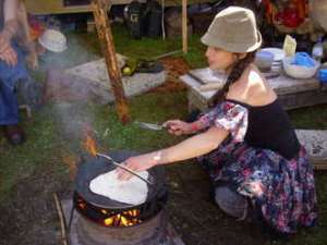 Chapatti cooking on open fire at Buddhafield festival 2008