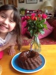 Happy grandchild with chocolate bean cake