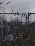 Bailliffs' steel fence and spotlights protest camp Metrobus Bristol