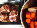 roasted bones and pan with carrots and onions
