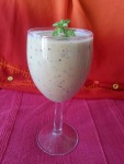wine glass of creamy looking smoothie 