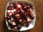 A bowl of cooked beetroot and feta cheese