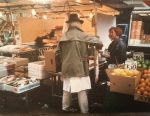 Fay Winkler shopping from Pat Wright fishmonger Tachbrook Street Market London SW1 in the 1980s